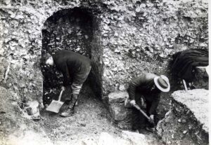 men digging with shovels